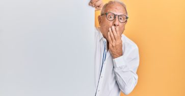 man in white dress shirt wearing black framed eyeglasses